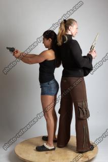 2021 01 OXANA AND XENIA STANDING POSE WITH GUNS (3)